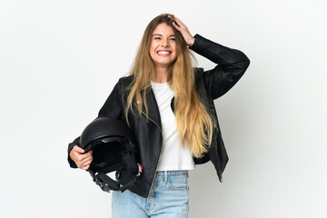 Woman holding a motorcycle helmet isolated on white background with surprise expression