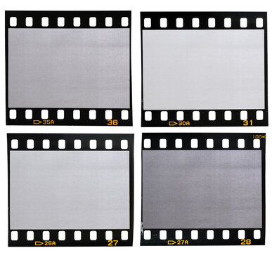four different 35mm film strips with blank or empty frames on white background. vintage photo placeholder.