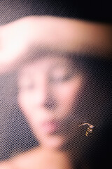 woman behind tulle with flowers II