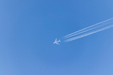 Vapor tails behind a plane