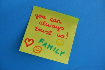 you can always trust us! Family paper note on blue wall