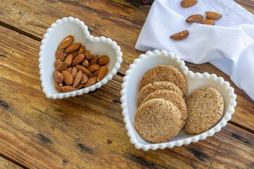 Homemade almond vegan cookies - in heart-shaped bowl