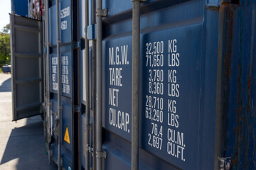 Stack of containers in a harbor. Shipping containers stacked on cargo ship. Background of Stack of Containers at a Port.