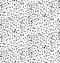 Seamless pattern of hand-drawn black dots. Suitable as a pattern for fabric