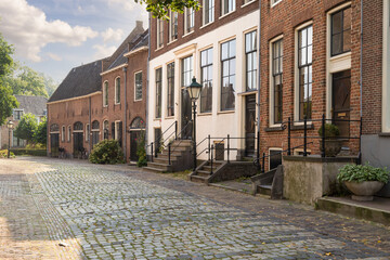 Street with old historic houses in the Hanseatic city of Zutphen in the Netherlands.