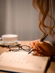 person writing in a book