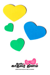 Valentines day concept. Multicolor hearts on white background and Happy Valentines day translate Tamil text. copy space