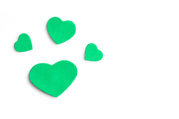 Valentine's Day. Isolated green hearts on a white background, top view, copy space