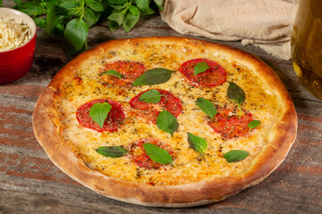 Margherita pizza on wooden background