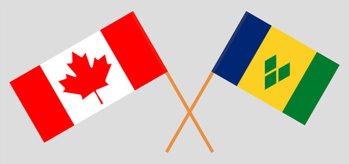 Crossed flags of Canada and Saint Vincent and the Grenadines. Official colors. Correct proportion