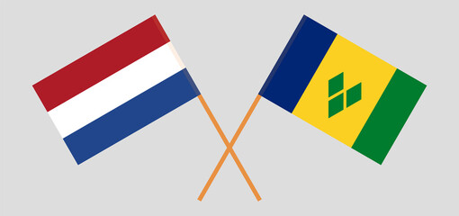 Crossed flags of the Netherlands and Saint Vincent and the Grenadines. Official colors. Correct proportion