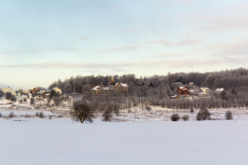 A village was visible beyond the winter fields