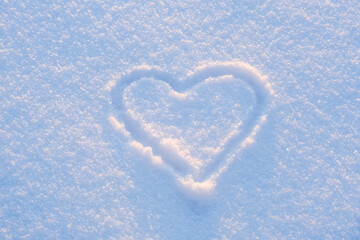 Hand drawn heart shape in the fresh snow
