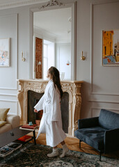 woman in the bathrobe dancing at home