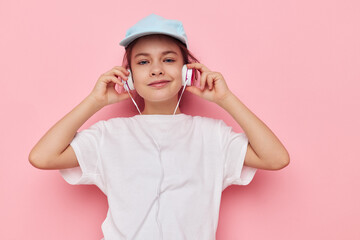 cute girl headphones in a white t-shirt and a cap Lifestyle unaltered