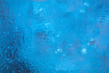 closeup of ice with colourful backlight for design purpose