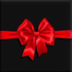 Dark gray background with a red festive bow.