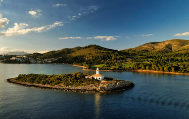 Panoramic view of a lighthouse standing at the coast of Mallorca	