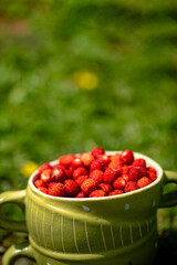 strawberries in the green cup