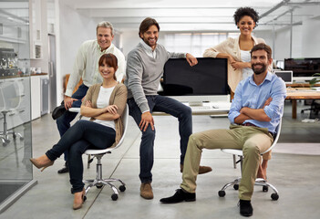 Fototapeta na wymiar Great office vibe. Portrait of a group of dedicated and dynamic design professionals.
