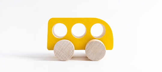 Wooden toy car in cartoon style on white background. Colorful and Transportation background, eco kid toys Montessori . 
