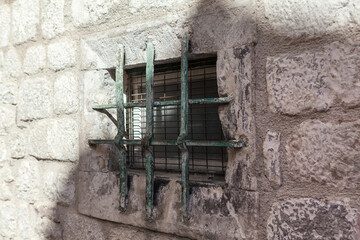 Prison window . Window with grates and brick wall