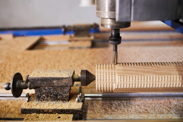 Wood carving machine. Modern automatic woodworking machine with CNC. Furniture production.
