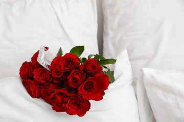 Rose flowers and condom in bedroom after romantic date