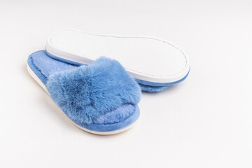 Blue women's home slippers. Space for text. Comfortable sole