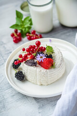 fresh ricotta with berries and flowers