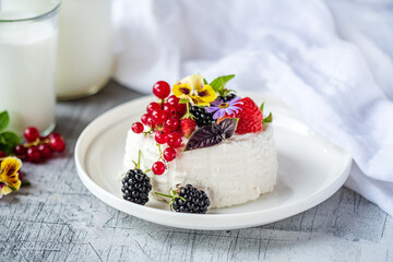 fresh ricotta with berries and flowers