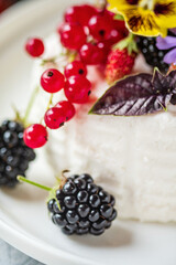 fresh ricotta with berries and flowers