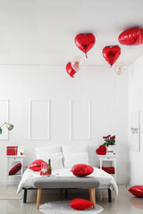 Interior of bedroom decorated for Valentine's Day in morning