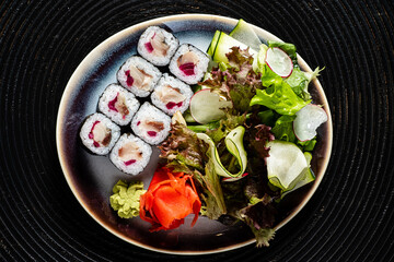 sushi on the black plate