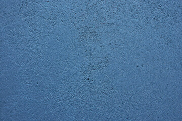 Dark blue concrete wall texture.