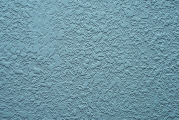 turquoise background. Abstract texture of plaster or wallpaper.