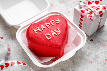 Plastic lunch box with tasty bento cake on light background, closeup