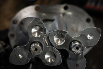 Internals taken out from an internal combustion engine supercharger in a workshop.