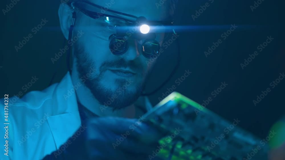 Poster technician engineer developer is soldering iron pcb microcircuit electronic component though magnifi