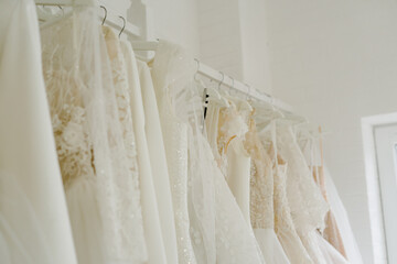 Obraz na płótnie Canvas Wedding salon with designer dresses. Beautiful designer dresses.