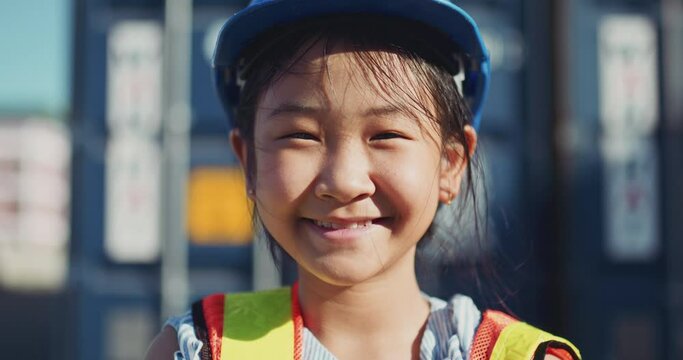 Portrait of a little girl in with safety helmet engineer concept