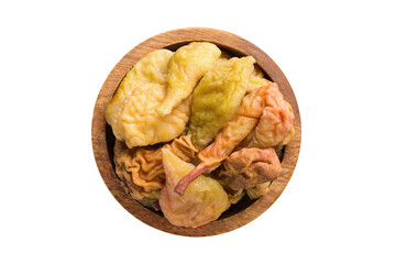 dried pears in wooden bowl isolated on white background. Vegan food, top view.