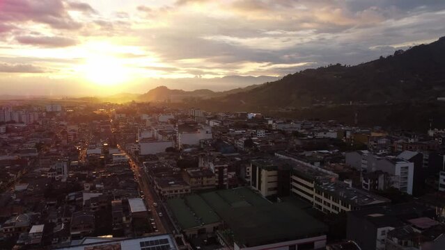 aerial shot rising from the city of Pereira Colombia at sunset