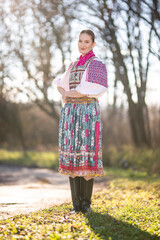 Young beautiful slovak woman in traditional dress. Slovak folklore
