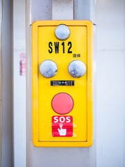 sos emergency button on the platform of train station in japan