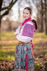 Young beautiful slovak woman in traditional dress. Slovak folklore