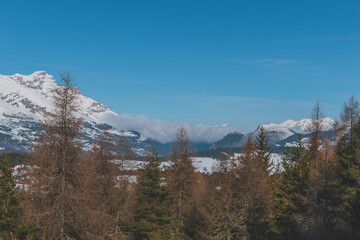 A picturesque landscape view of the French Alps mountains on a cold winter day (La Joue du Loup, Devoluy)
