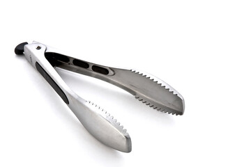 Metal kitchen tongs, stainless steel for serving, isolated on white background	