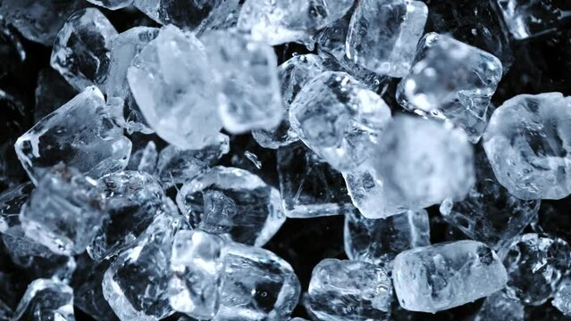 Super slow motion of falling ice cubes separated on black background. Filmed on high speed cinema camera, 1000 fps.
