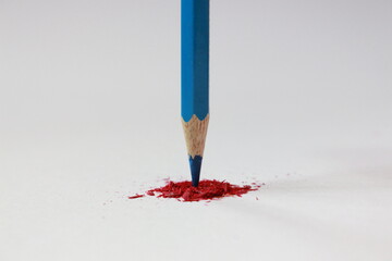 blue pencil color on red scratches and white background 